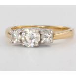 An 18ct yellow gold 3 stone diamond ring approx. 1.25ct, size M 1/2