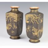 A pair of black ground Satsuma vases decorated with dragons chasing the flaming pearl 16cm Both