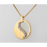 An 18ct yellow gold diamond set pendant and chain 9.3 grams