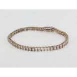 A 14ct white gold diamond tennis bracelet, approx. 4ct, 17.5cm