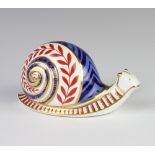 A Royal Crown Derby Imari pattern paperweight in the form of a snail with silver stopper 13cm