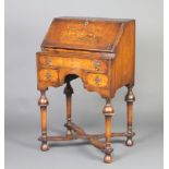 A Queen Anne style inlaid walnut bureau, the fall front revealing a well fitted interior above 1