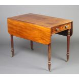 A 19th Century mahogany Pembroke table fitted a drawer, raised on turned supports with brass caps