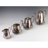 An Edwardian silver plated 4 piece tea and coffee set with chased floral decoration