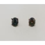 A pair of silver black Ethiopian opal ear studs
