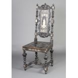 A 19th Century Italian ebonised and inlaid ivory hall chair with solid seat, the slat back inlaid
