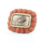 A 19th Century gold and coral memoriam brooch