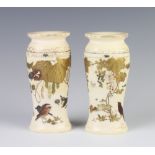 A pair of Meiji period ivory oval vases with shibayama decoration of birds and insects amongst