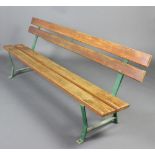 A slatted hardwood and metal garden bench 76cm h x 291cm w x 51cm d
