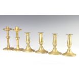 A pair of Victorian brass candlesticks raised on petal bases 19cm together with 4 19th Century
