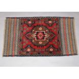 A red and brown ground Belouche rug 137cm x 82cm