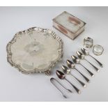 Six silver teaspoons, a pair of tongs and 2 napkin rings, 124 grams, a plated salver and cigarette