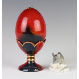 A Royal Doulton flambe egg on stand 13cm together with a Danish figure of a mouse 2.5cm