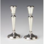 A pair of tapered silver candlesticks of plain form, Birmingham 1985, 19cm, gross 187 grams