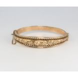 A 9ct yellow gold repousse bangle 15.8 grams