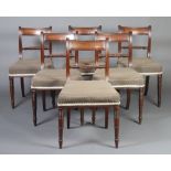 A set of 6 Regency mahogany bar back dining chairs with rope turned mid rails and over stuffed
