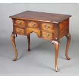 A Georgian style mahogany low boy fitted an arrangement of 5 drawers with brass plate drop