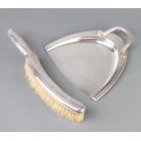 An Art Deco silver plated chrome scoop and brush