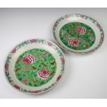 A pair of 18th Century famille rose shallow dishes decorated with peony 37cm One is cracked