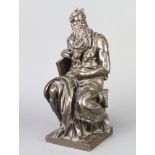 A 19th Century bronze figure of a seated classical gentleman with book, raised on a square base,