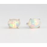 A pair of silver and ethiopian opal ear studs