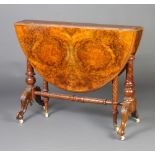 A Victorian oval figured walnut Sutherland table raised on carved supports 69cm h x 89cm w x 15cm