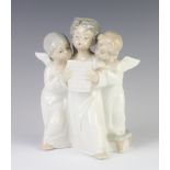 A Lladro group of 3 singing angels 18cm