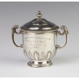 A stylish silver 2 handled trophy and lid, London 1936, 191 grams