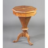 A Victorian octagonal work table of conical form and fitted interior, raised on carved pillar and