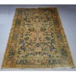 A peach ground and floral patterned Oshak carpet 299cm x 201cm, light flecking in places