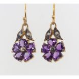 A pair of silver gilt amethyst and diamond floral earrings