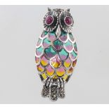 A silver enamel and ruby set owl brooch