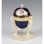 A 19th Century Meissen egg shaped box and cover, the blue ground with panels of flowers on