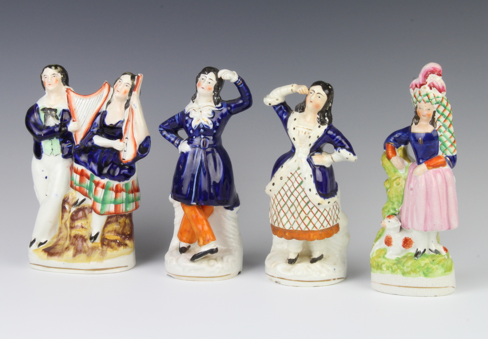 A pair of Staffordshire dancing figures 18cm and 2 other Staffordshire figure groups (1 group is