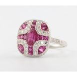 An Art Deco style platinum, ruby and diamond dress ring size N
