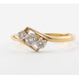 An 18ct yellow gold 3 stone diamond ring, size M, 2.1 grams