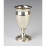 A silver urn shaped vase of plain form, London 1919, 13cm, 130 grams