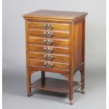 An Edwardian walnut mahogany music chest fitted 6 drawers with pressed copper plate drop handles