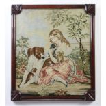 A Victorian woolwork panel of a young girl with dog and puppies in a mahogany frame 51cm x 43cm