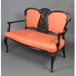 An Edwardian pierced ebonised and carved 4 piece drawing room suite comprising 2 seat sofa