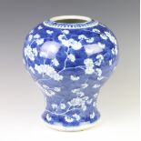 A Chinese antique style prunus pattern baluster vase 30cm