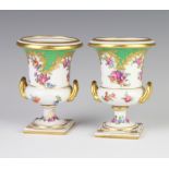 A pair of Dresden style 2 handled vases decorated with spring flowers 12cm 1 is stuck and cracked