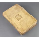 A Victorian parchment formed scrap book with Royal Arms, containing various monochrome prints
