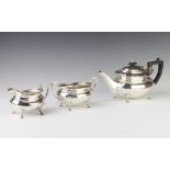 An Art Deco silver panelled 3 piece tea set with ebony mounts Sheffield 1933 and 1929, gross 1200