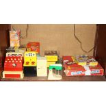 A 1960's Tudor Rose plastic model till boxed, a child's Rutland kitchen stove boxed (box worn) and a