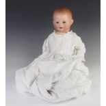 A German porcelain headed doll, head impressed German 241-3 with open eyes and open mouth with 2