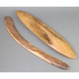 An Aboriginal boomerang 65cm x 4cm and a ditto shield 61cm x 15cm