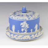 A Wedgwood style blue jasperware cheese dome and cover decorated with a band of classical figures