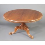 A Victorian mahogany circular snap top Looe table raised on a bulbous turned column and tripod