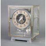 A 1930's Atmos clock, contained in a chrome case, numbered 4390, Brevets J.L Reutter S.G.D.G 24cm